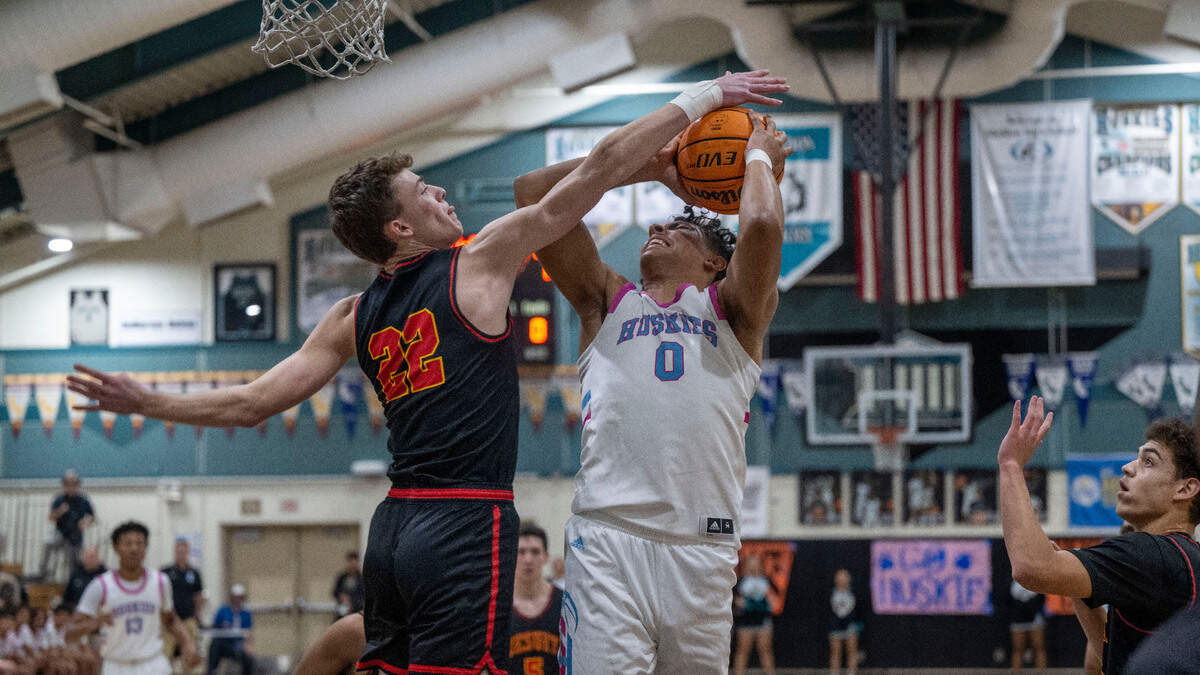 Sheldon’s Jaden Woodard, right, is fouled by Jesuit’s Asher Schroeder in the first half of a Delta League basketball game Wednesday, Jan. 3, 2024, at Sheldon High School.
