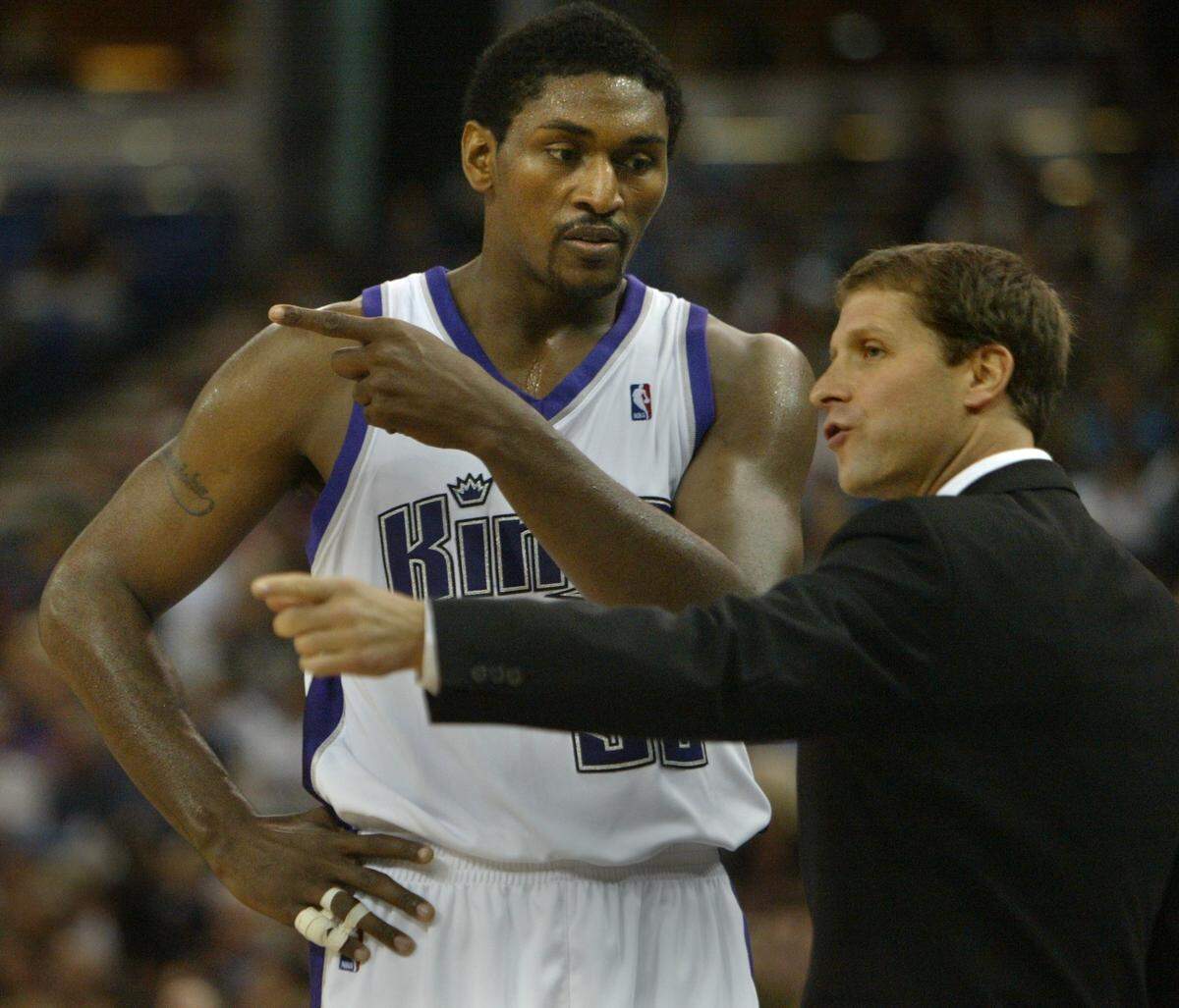 Kings coach Eric Musselman talks with Ron Artest during a game against the Charlotte Hornets at Arco Arena on Oct. 24, 2006.