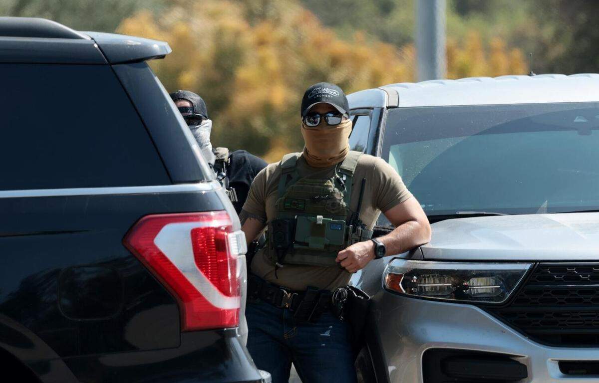 Federal agents stage outside Gate E of Dodger Stadium in Los Angeles on June 19.