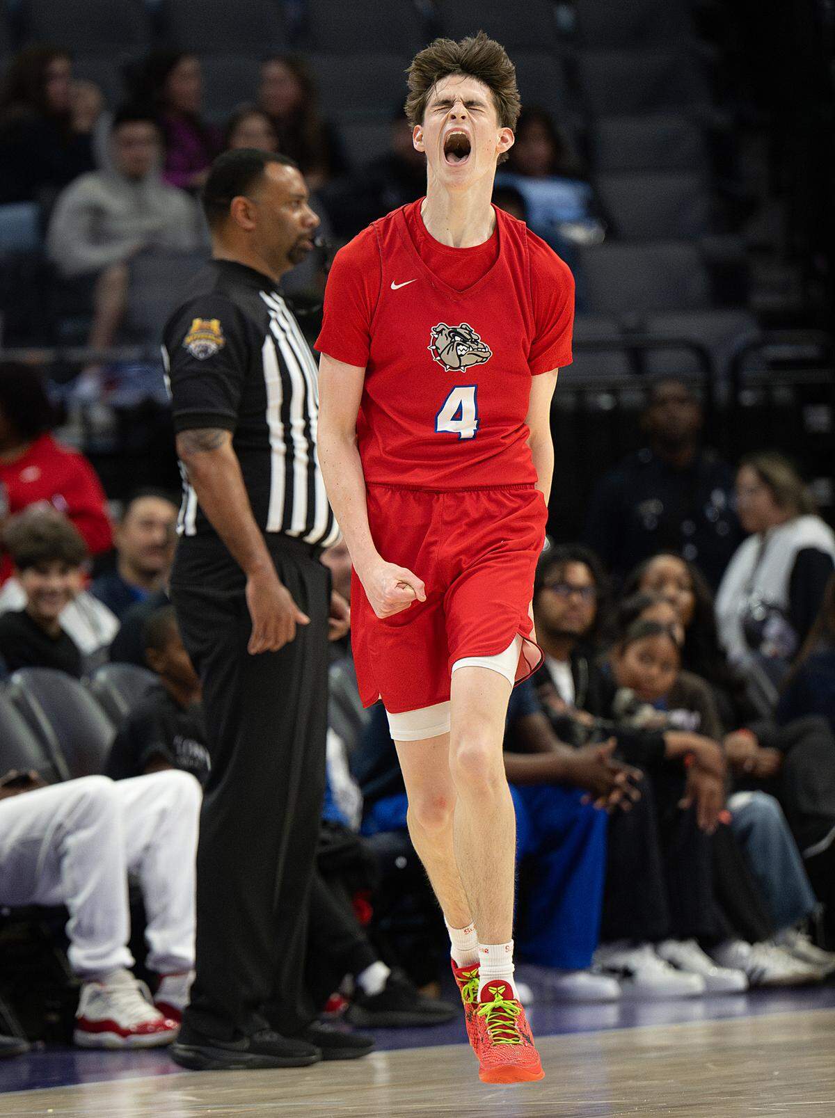 Folsom’s Chase Rawlins reacts to scoring a three-point shot in the Sac-Joaquin Section Division I championship game with Modesto Christian at the Golden 1 Center on Friday.