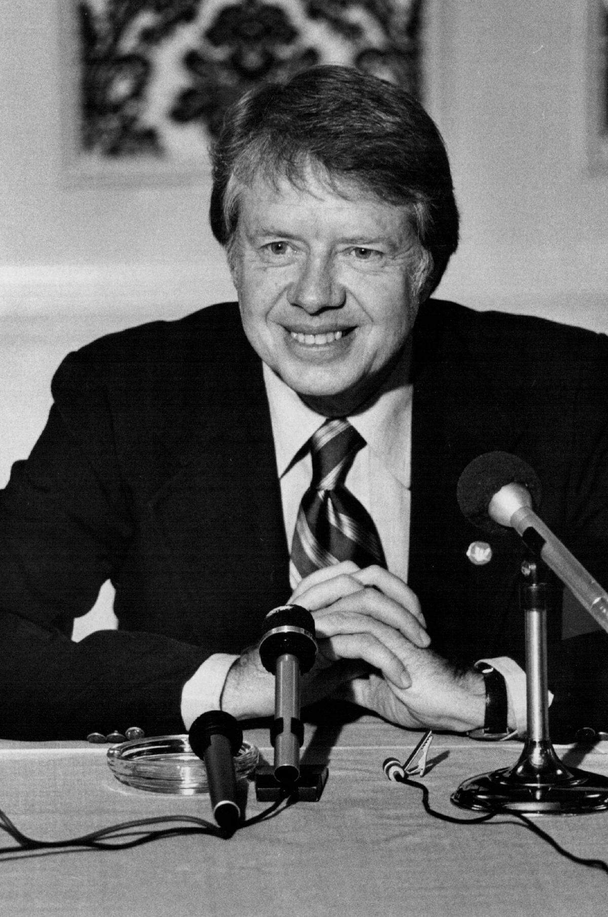 Former Georgia Gov. Jimmy Carter, Democratic candidate for president, answers a reporter’s question during a news conference at the Hotel Senator in Sacramento on Oct. 9, 1975. It was his eighth to California since announcing his candidacy.