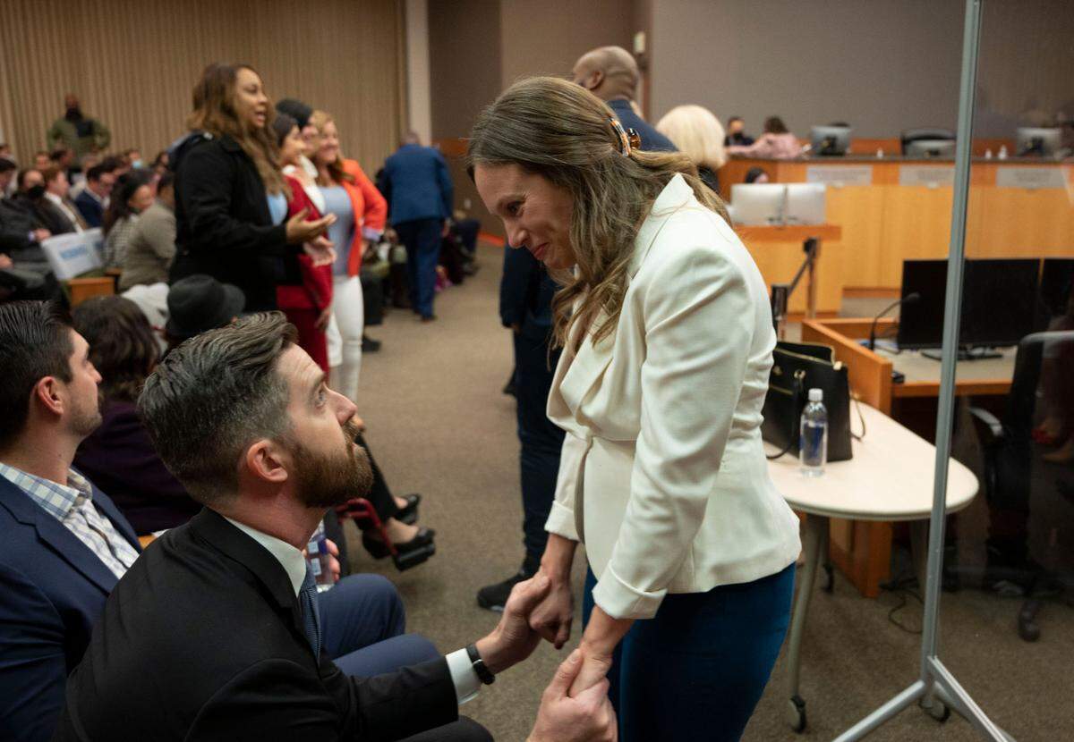Caity Maple shares a moment of excitement with her husband, Sam Rice, in December 2022, before being sworn in to the Sacramento City Council.