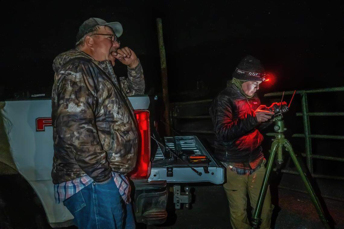 Researcher Lori McCurdy flies a drone equipped with thermal imaging and speakers to monitor cattle and deter wolf activity late in the evening Friday, Sept. 12, in Sierra Valley as Sierra County Supervisor Paul Roen, who often operates his own drone to track his cattle, stands nearby.