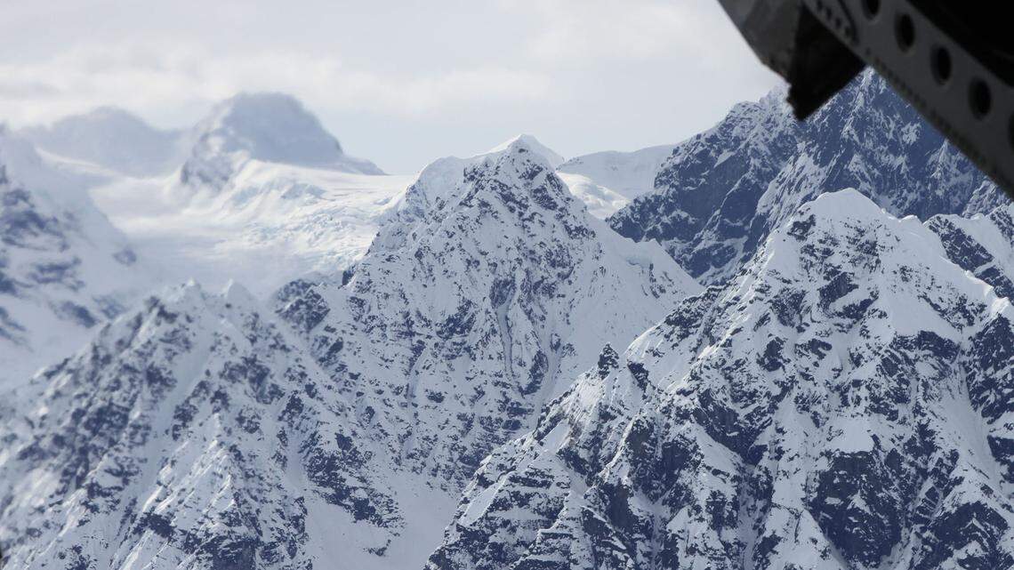 File photo of Denali mountain in Alaska, taken from a U.S. Army helicopter. A Utah doctor was recently banned from climbing Denali for five years after federal officials say he tried faking the need for an airlift rescue.