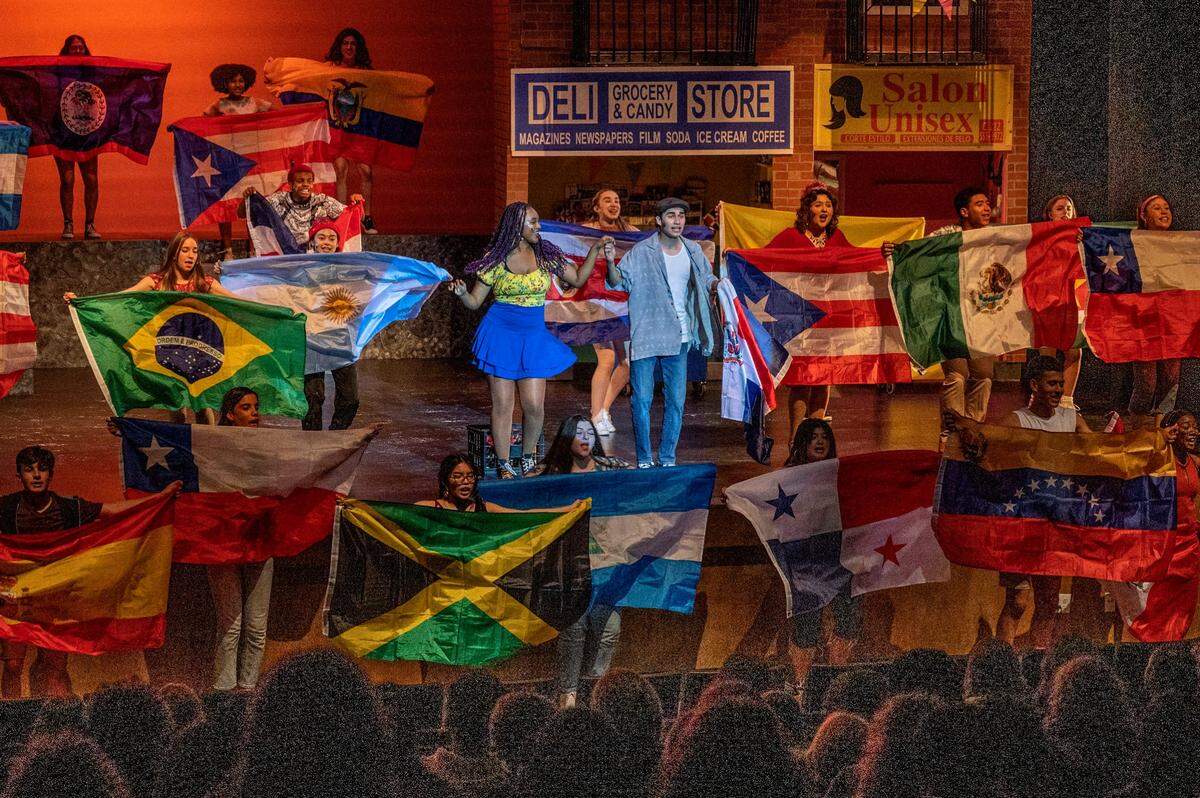 Natomas Charter School students Genesis Crowly, 17, and Ali Qadiri, 18, perform a scene Wednesday in their school’s production of Lin-Manuel Miranda’s “In the Heights.” Qadiri, who plays lead Usnavi, said his character resonates with him. “Both my parents are immigrants. My father is a refugee from Afghanistan and my mother is an immigrant from Mexico. All of my family always refers to Afghanistan and Mexico as home, as in ‘when I go back home’ … ‘when I die bury me in my home.’ It’s so interesting to be able to see that connection on stage,” he said.
