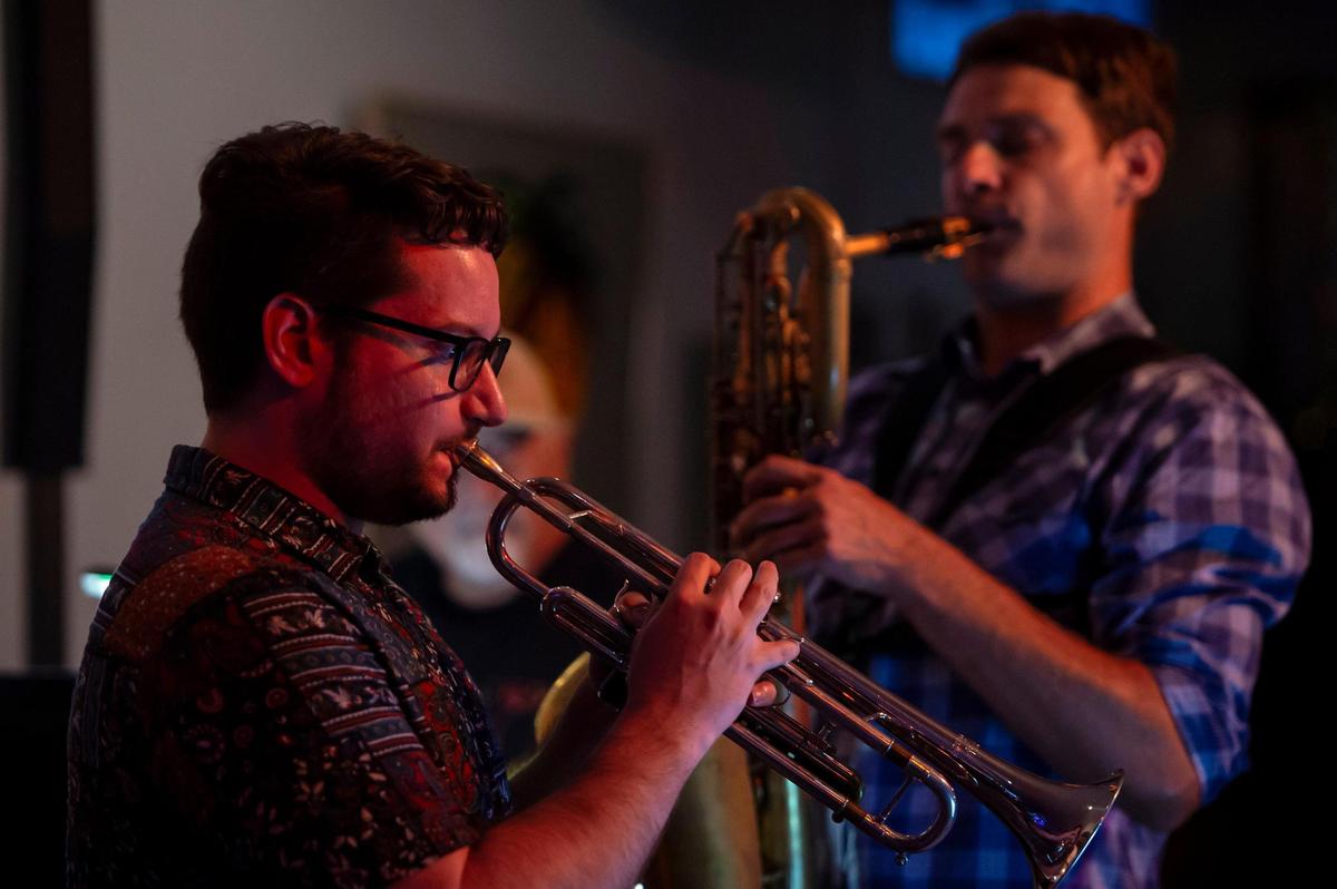 Nick Niebank plays the trumpet and Byron Colborn plays saxophone at Luna’s Cafe on Monday night. In August, Luna’s Cafe will host its final show.