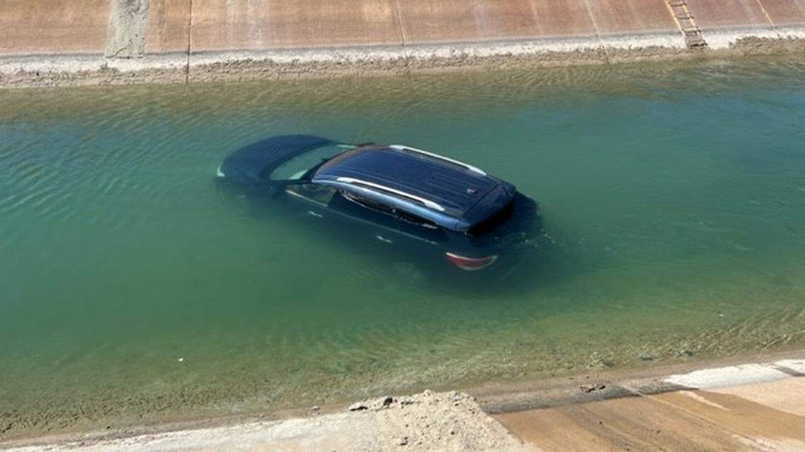 A golfer helped save the driver of a car that plunged into a rain-swollen canal during an Indio golf tournament, California officials say.