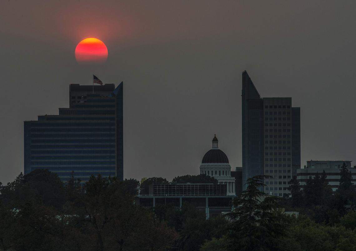 The sun sets on the Sacramento skyline on Monday, Aug. 7, 2018, with surrounding wildfires affecting the air quality in Sacramento. On Thursday, Jan. 15, 2026, the air quality was in “unhealthy for sensitive groups” range due to fine particulate matter.