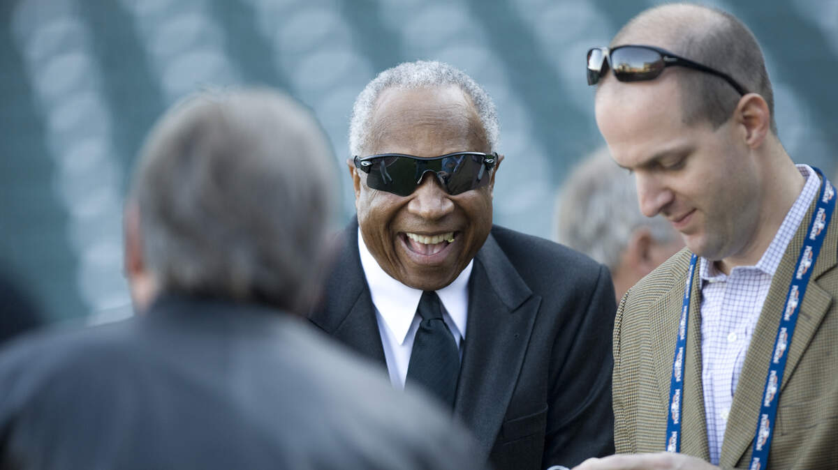 Frank Robinson enjoys a laugh before a game between the San Francisco Giants and the Atlanta Braves in 2010. Robinson, a trailblazer who forged his own path from the playgrounds of West Oakland to baseball immortality, died Thursday after a long battle with bone cancer, according to several reports. He was 83.