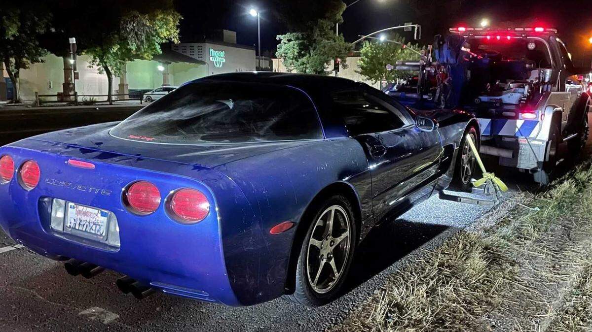 A Chevrolet Corvette is photographed Saturday, Oct. 14, 2023, attached to a tow truck following the arrest of the driver on suspicion of reckless driving at Mace Boulevard and Chiles Road in Davis.