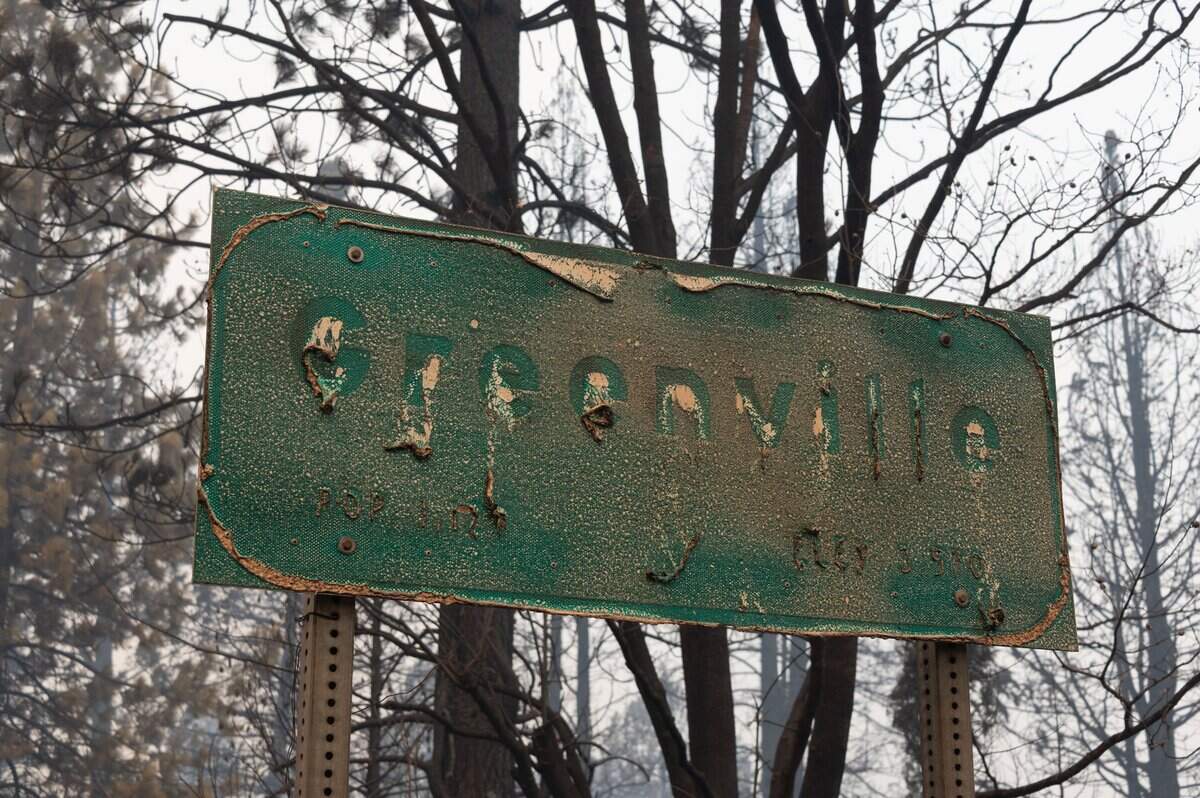 Ghostly outlines remain from the letters of the Greenville highway sign on Thursday, Aug. 5, 2021, after the Dixie Fire burned the town on Wednesday.