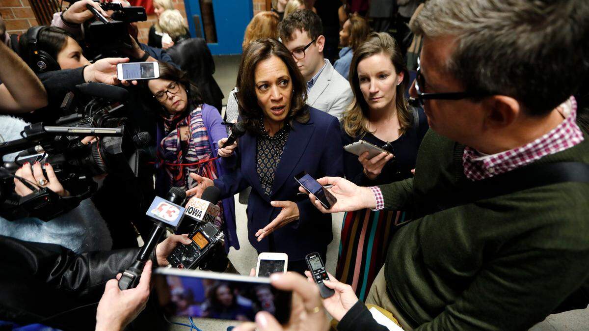 Sen. Kamala Harris, D-Calif., center, speaks to reporters following a rally Monday at Des Moines Area Community College. As she tests the waters for a potential 2020 presidential run, her tax credit proposal is drawing attention.