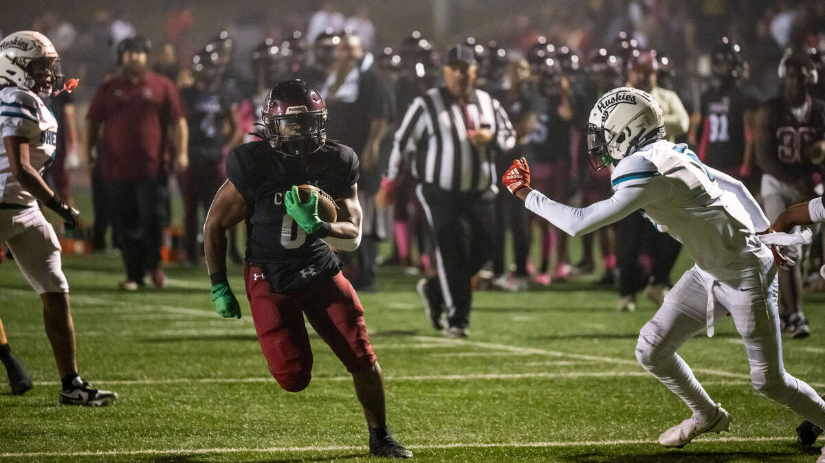 The Laguna Creek Cardinals’ Armon Thorntona (0) sprints to his first touchdown against Sheldon on Friday at Cosumnes River College. Thorntona had six touchdowns on the night.