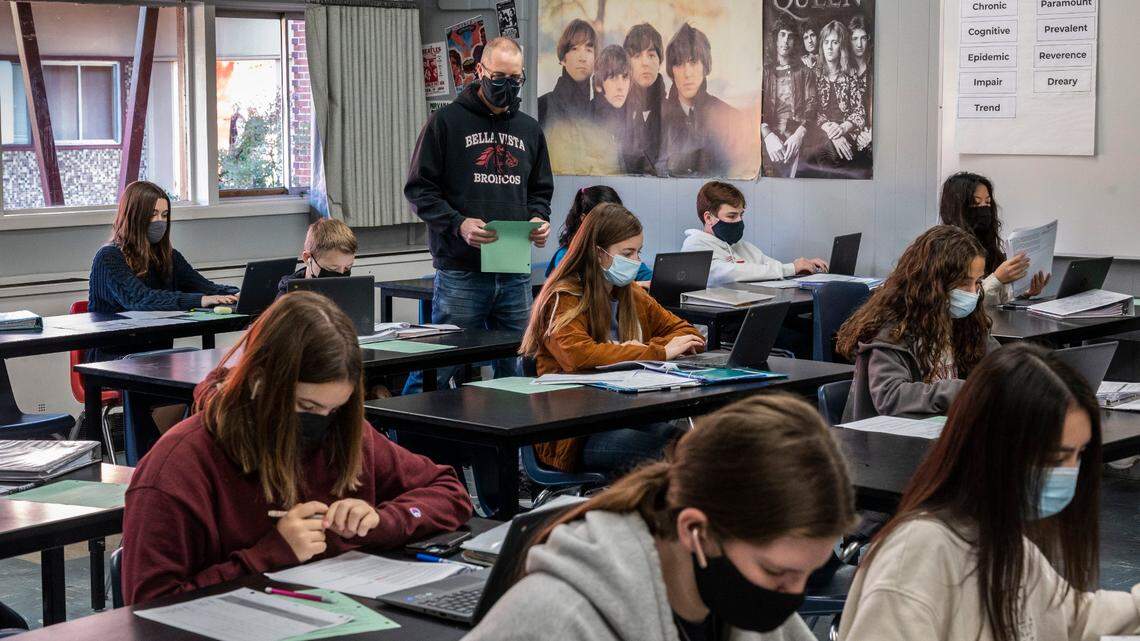 Bella Vista High School teacher Eric Leach teaches on Friday, Jan. 14, 2022, during his honors English class as the San Juan Unified School District struggles with the omicron variant that has kept many teachers and students away during the COVID-19 pandemic.