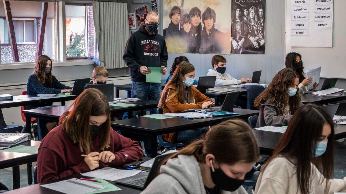 Bella Vista High School teacher Eric Leach teaches his honors English class Friday as the San Juan Unified School District struggles with the omicron variant of COVID-19 that has kept many teachers and students away from school.