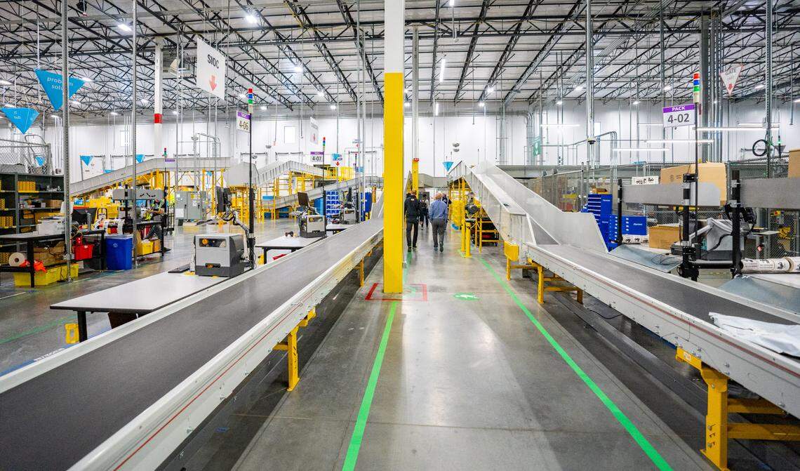 Conveyor belts run throughout the the Amazon Sacramento-region same-day delivery center, moving packages from one station to the next on Wednesday.