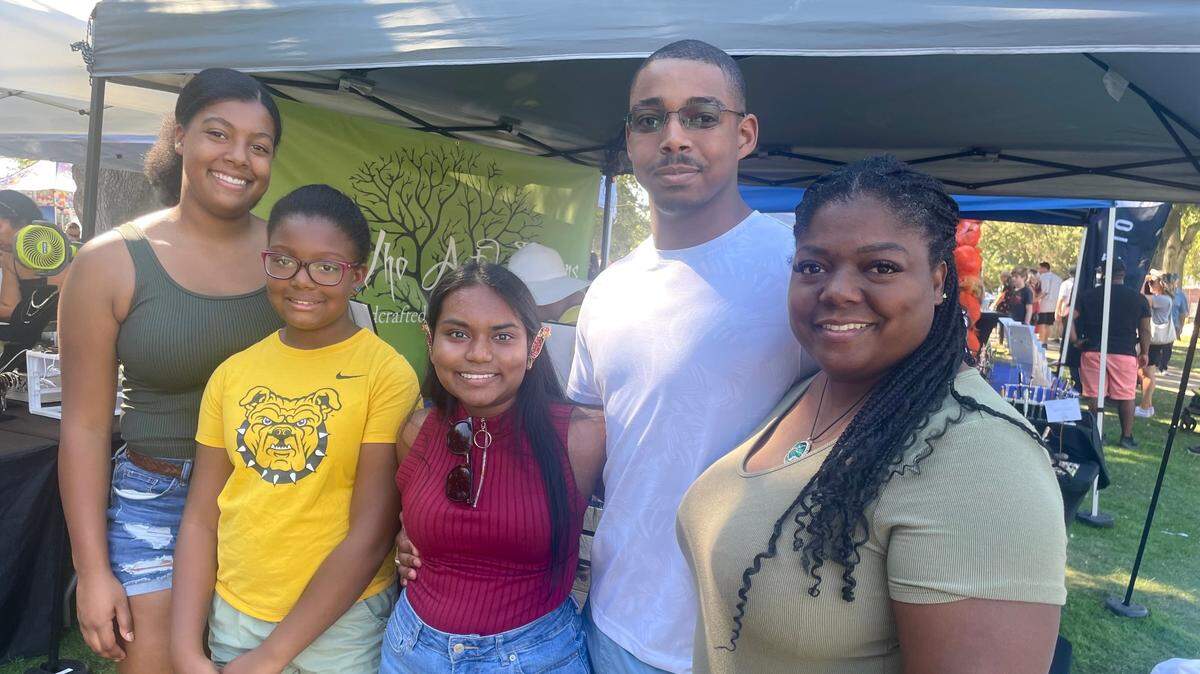 From left, Makaila Ross, Malia Ross, Vibha Torres-Royal, Curtis Ross III and Stephanie Ross pose together during the Elk Grove Pumpkin Festival on Oct. 7.