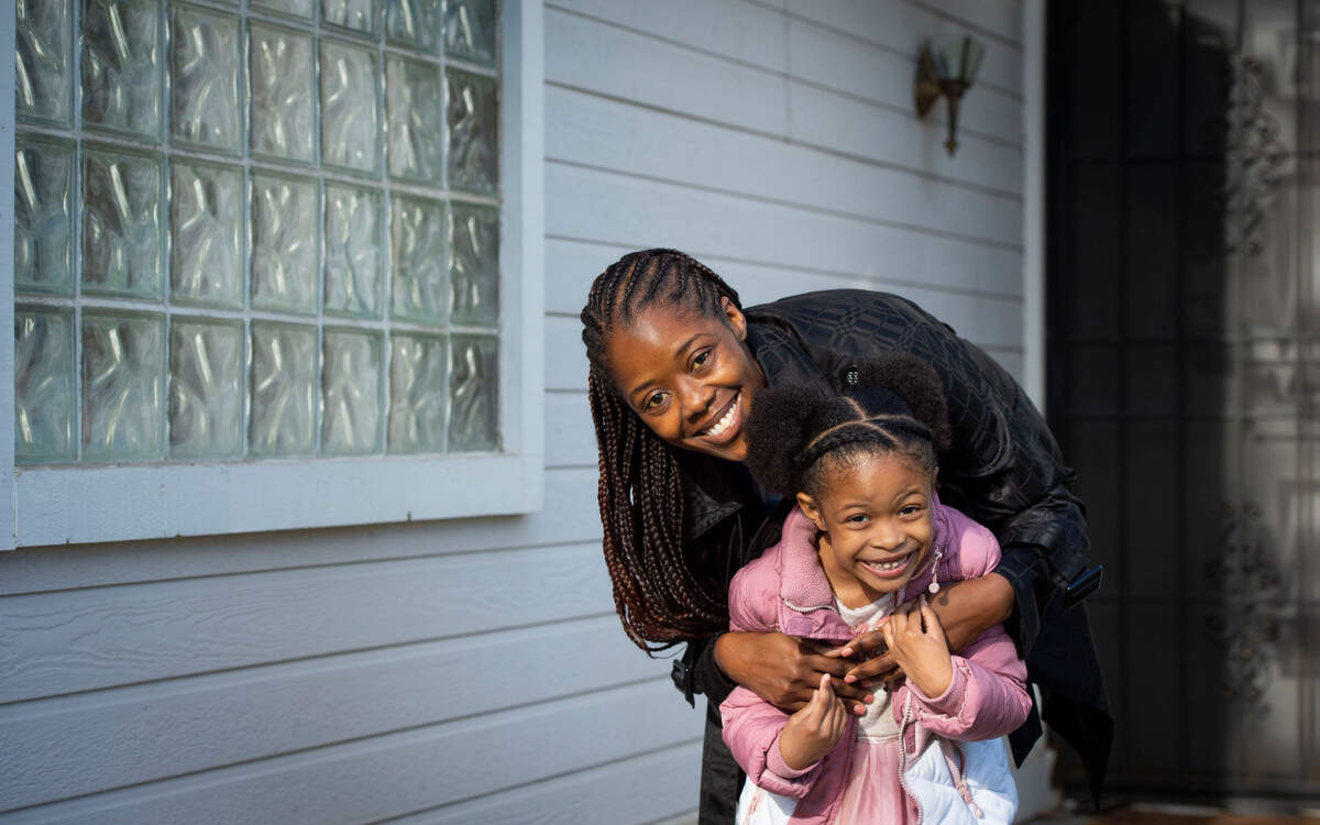 Kamilah Bailey, 44, stands with her daughter, Mychaela Williams, 5, at their home in Elk Grove on Dec. 11. Bailey has sickle cell disease and says blood transfusions are an essential treatment. 
