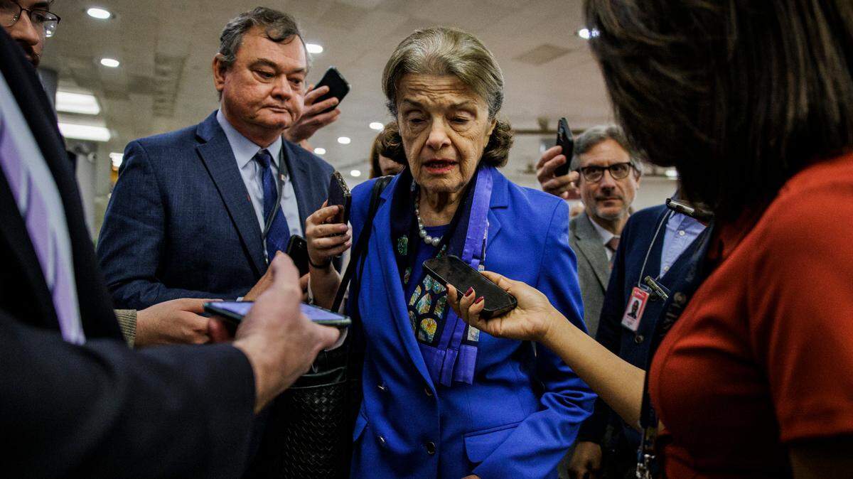 U.S. Senator Dianne Feinstein, D-California, is surrounded by reporters on Feb. 14, 2023, on Capitol Hill in Washington, D.C., announcing that she will retire from the Senate at the end of her term in 2024.
