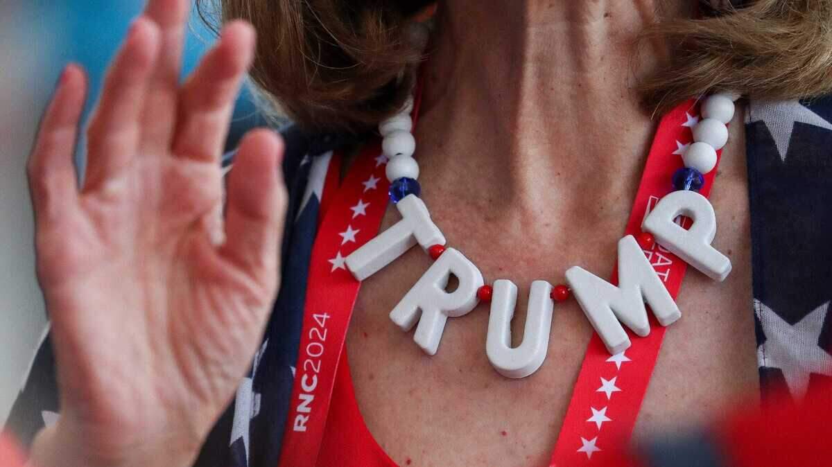A Donald Trump supporter wears a Trump-themed necklace during the final day of 2024 Republican National Convention on July 18, 2024, in Milwaukee, Wis.