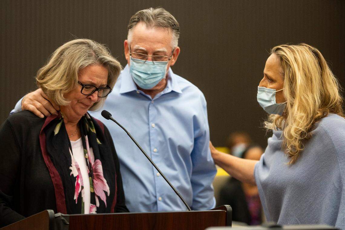 Gay Hardwick, left, is comforted by her spouse Bob Hardwick, center, and San Joaquin County’s District Attorney Tori Verber Salazar during the second day of victim impact statements with Joseph James DeAngelo present at the Gordon D. Schaber Sacramento County Courthouse on Wednesday, Aug. 19, 2020, in Sacramento, Calif. Victims of the California serial killer and rapist, want him in a maximum security prison far, far away if he can’t spend the rest of his life on death row. In June, DeAngelo pleaded guilty to 13 murders and 13 rape-related charges between 1975 and 1986.