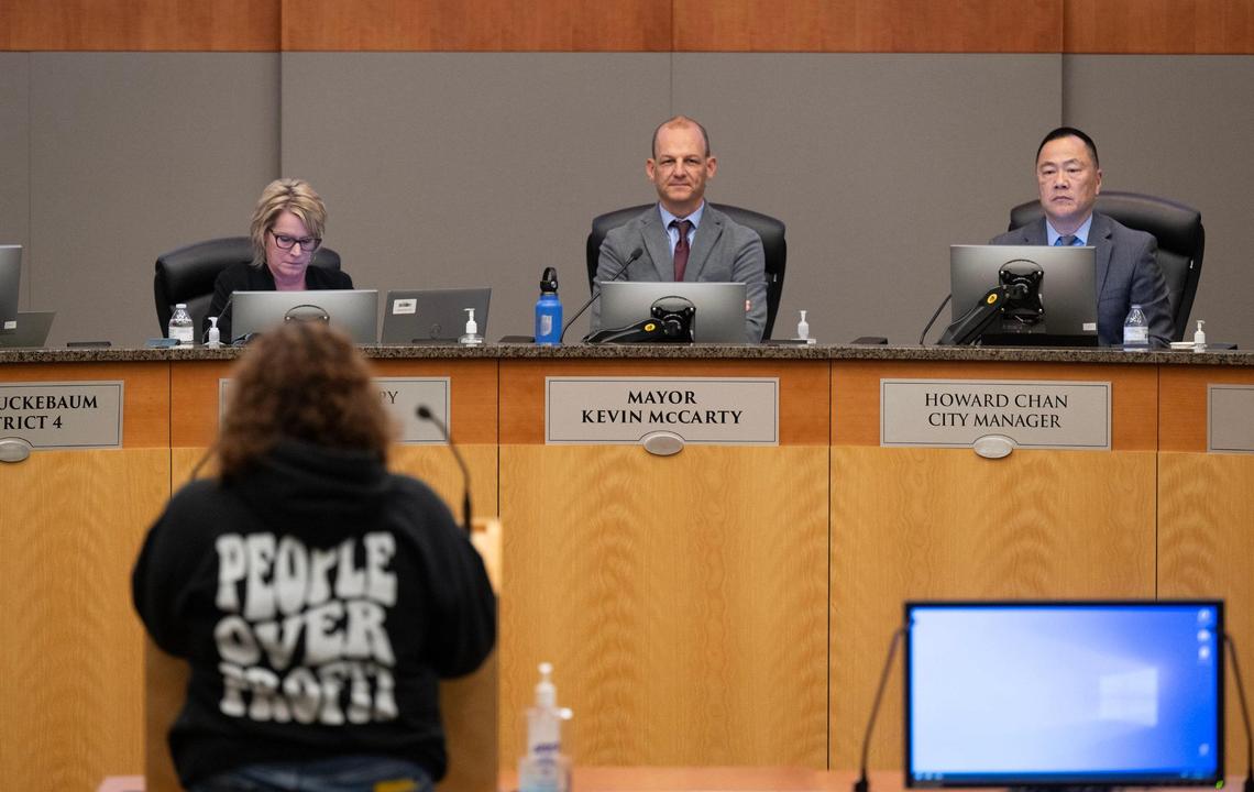 Sacramento Mayor Kevin McCarty and City Manager Howard Chan listens to Andrew Bianchi as he urges the City Council not to retain extend Chan’s contract on Tuesday, Dec. 17, 2024. The council voted 6-3 against the extension.