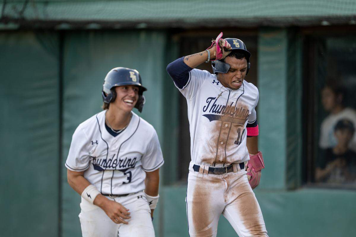The Elk Grove Thundering Herd's Chase Dyer (3) and Tristen Bartlett (11) score in the bottom of the fourth inning against the Rodriguez Mustangs on Thursday, May 20, in the CIF Sac-Joaquin Section Division II baseball championship at Sacramento City College.