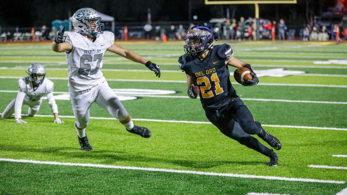 Del Oro’s Sheldon Conde looks for more running room against Granite Bay. 