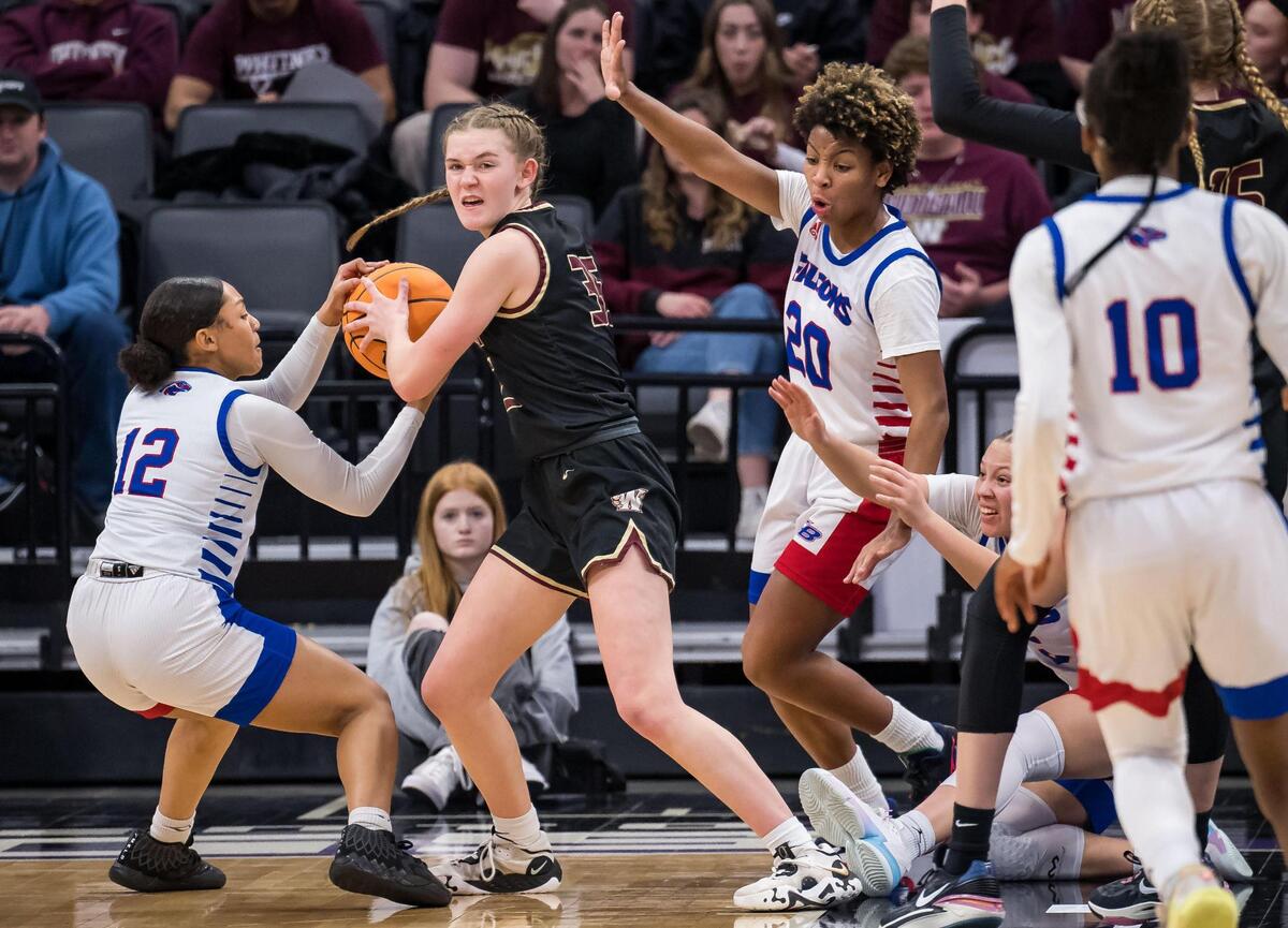 Whitney Wildcats guard Kendall Dykstra (35) is fouled by Christian Brothers Falcons’ Kemani Williams (12), left, during the fourth quarter of the CIF Sac-Joaquin Section Division II high school girls basketball final game Friday, Feb. 24, 2023, at Golden 1 Center in Sacramento.