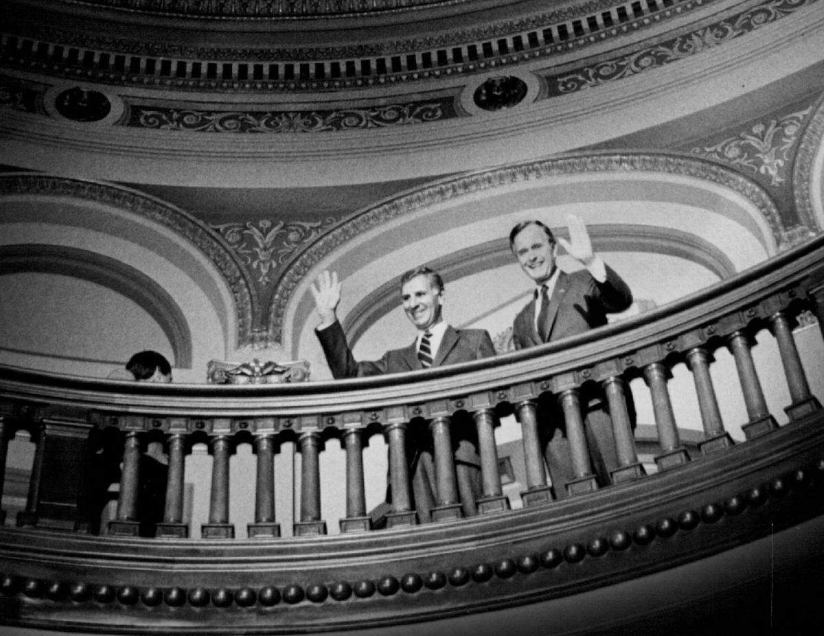 Gov. George Deukmejian , left, introduces President George Bush at the Capitol in Sacramento.