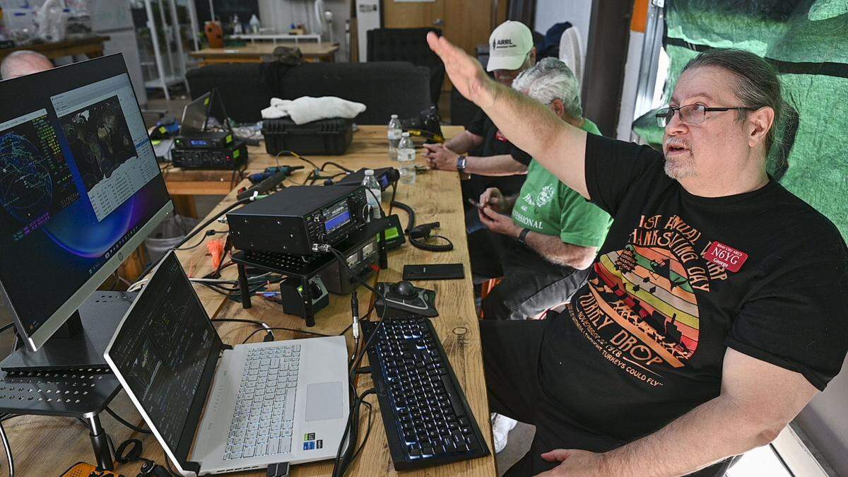 George Poulos with the River City Amateur Radio Communications Society tracks a satellite Saturday while testing out the radio’s audio feed in preparation for the Girl Scouts communications with the ISS astronauts next week.