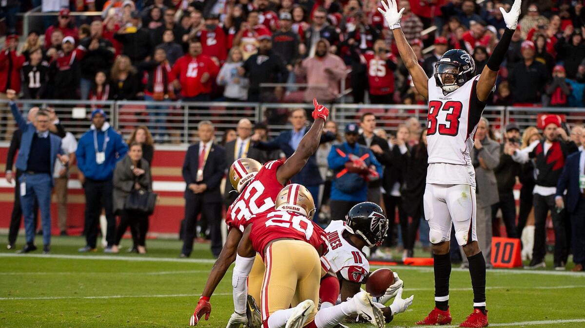 Atlanta Falcons wide receiver Julio Jones (11) scores the winning touchdown against by San Francisco 49ers free safeties D.J. Reed (32) and Jimmie Ward (20) at the end of the fourth quarter at Levi’s Stadium on Sunday, December 15, 2019 in Santa Clara. Falcons wide receiver Russell Gage (83) makes the touchdown signal.