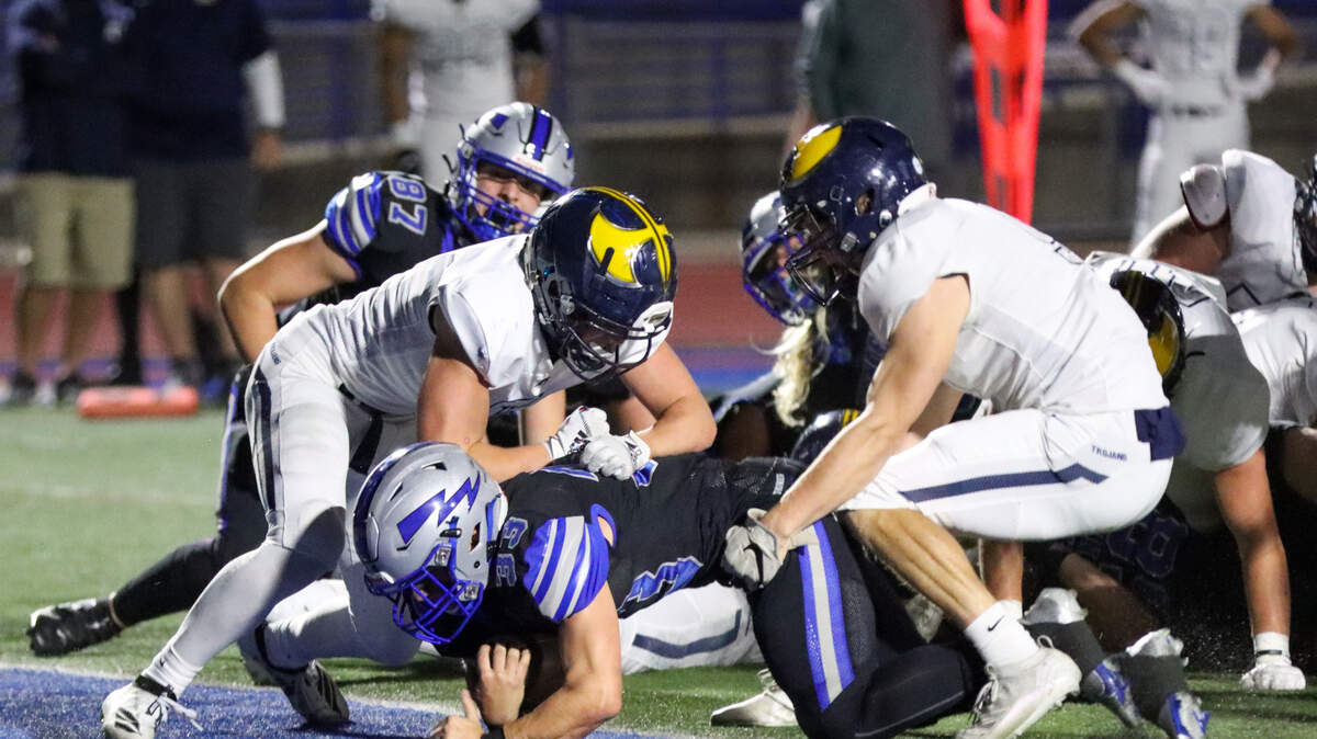 Rocklin running back Mason Thomas (33) scores one of his two touchdowns in the 38-13 win over Oak Ridge Friday night in Placer County.