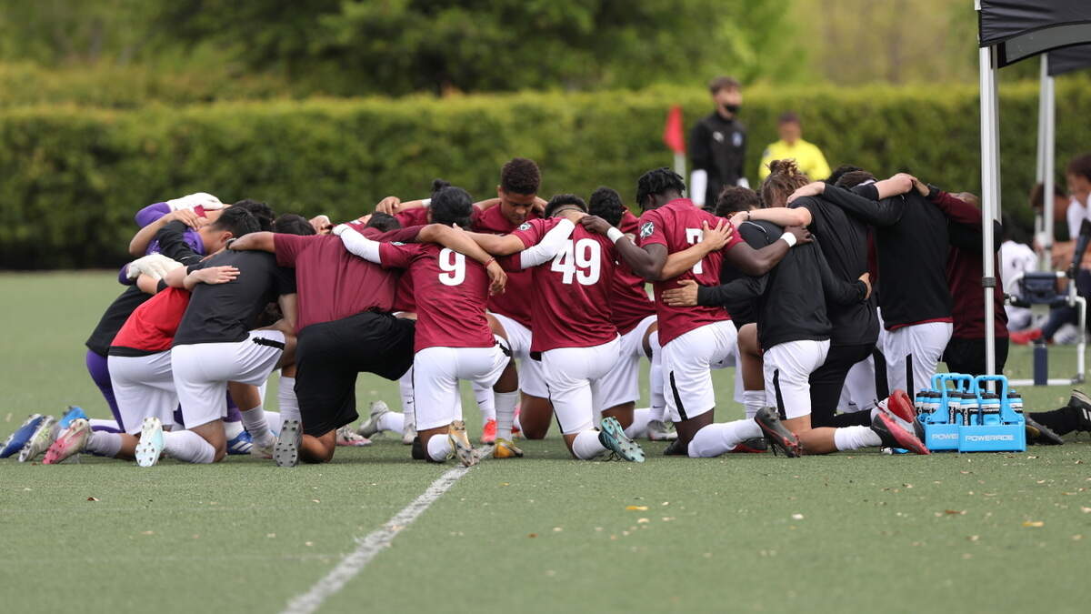 Sacramento Republic youth academy players huddle on the field. The team director says the players are bonding during a trip to Dallas.