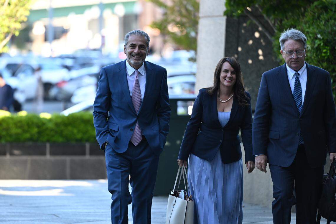 Former Sacramento City Councilmember Sean Loloee, left, arrives at the Robert T. Matsui United States Courthouse in Sacramento on Thursday, April 23, 2026, to plead guilty to charges involving fraud, tax violations and underpaying immigrant workers at his Viva Supermarket stores.