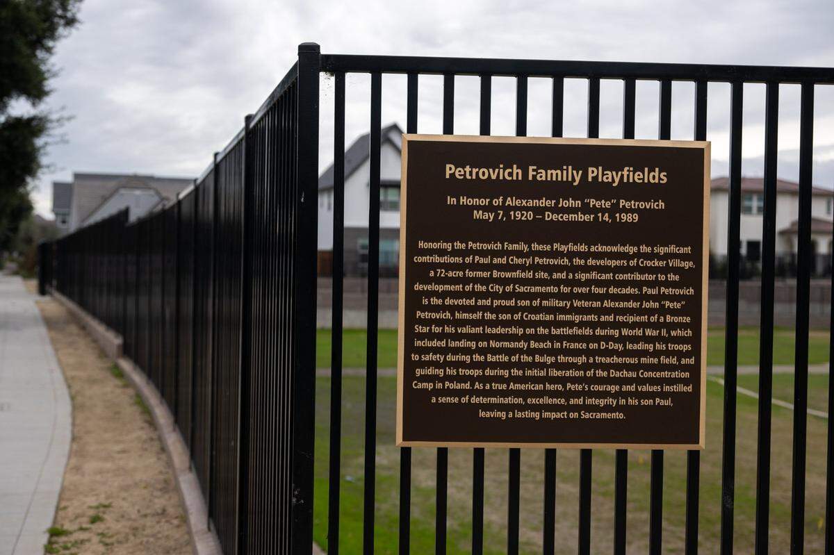A plaque at Petrovich Family Playfields in Sacramento’s Crocker Village development recounts the family history of developer Paul Petrovich, but gives an erroneous location for the Dachau Concentration Camp.