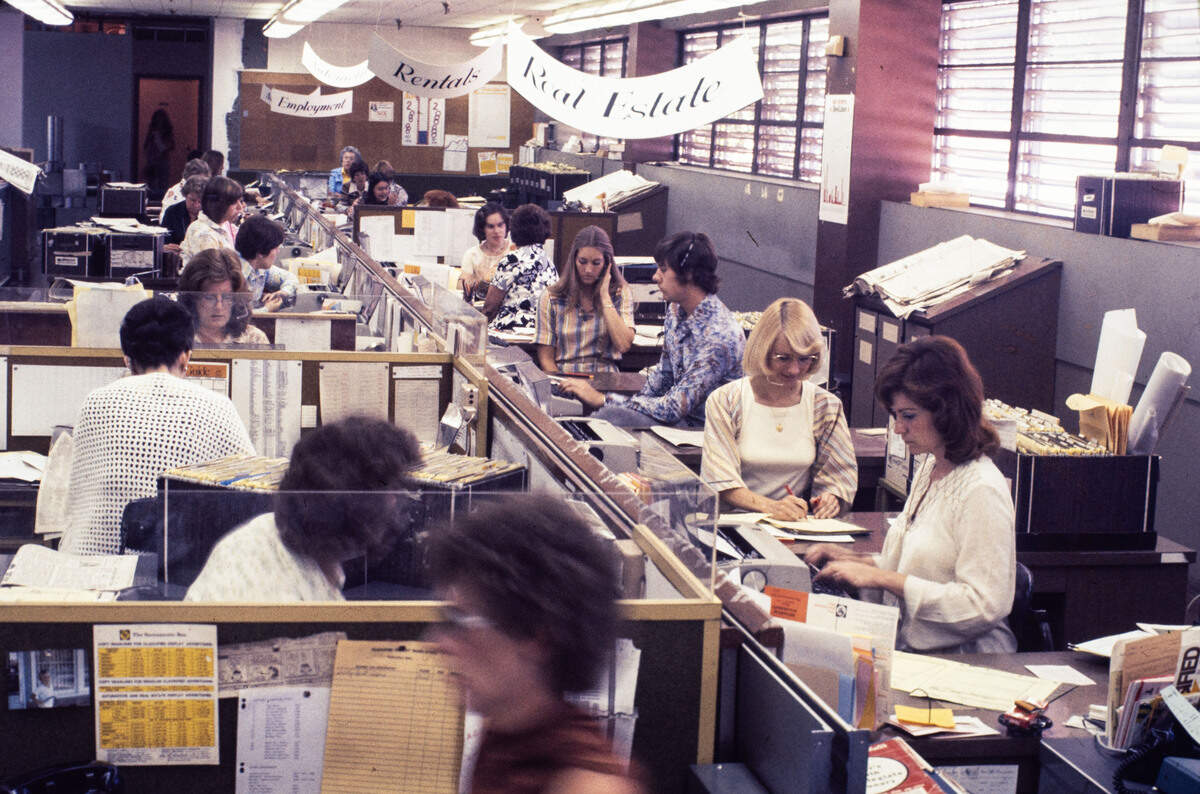 Workers take calls in The Sacramento Bee's classified advertising department at 2100 Q Street in 1976.
