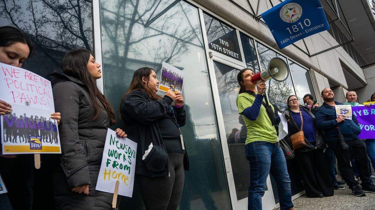 Anne Hilborn with the California Department of Fish and Wildlife spoke to demonstrators outside CalHR offices as she joined hundreds protesting Gavin Newsom’s order directing them to return to their offices four days a week on Wednesday, March 12, 2025, in Sacramento.