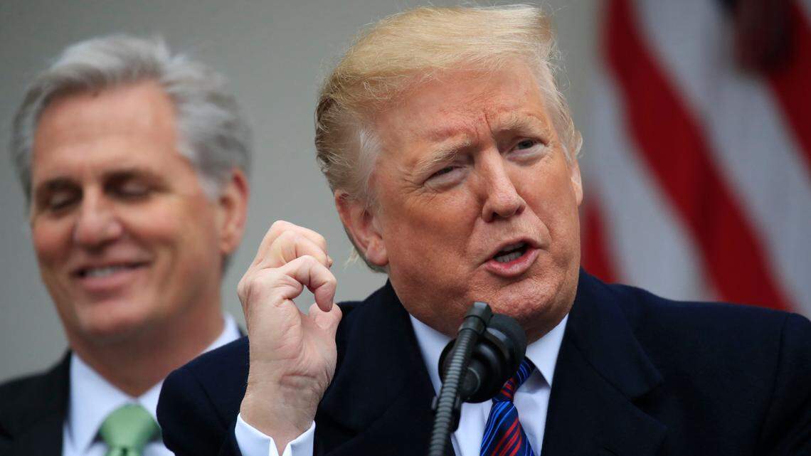President Donald Trump joined by House Minority Leader Kevin McCarthy of Calif., and other Congressional Republican leaders, gestures like he is talking on a phone during a news conference in the Rose Garden of the White House in Washington, after a meeting with Congressional leaders on border security, as the government shutdown continues Friday, Jan. 4, 2019.