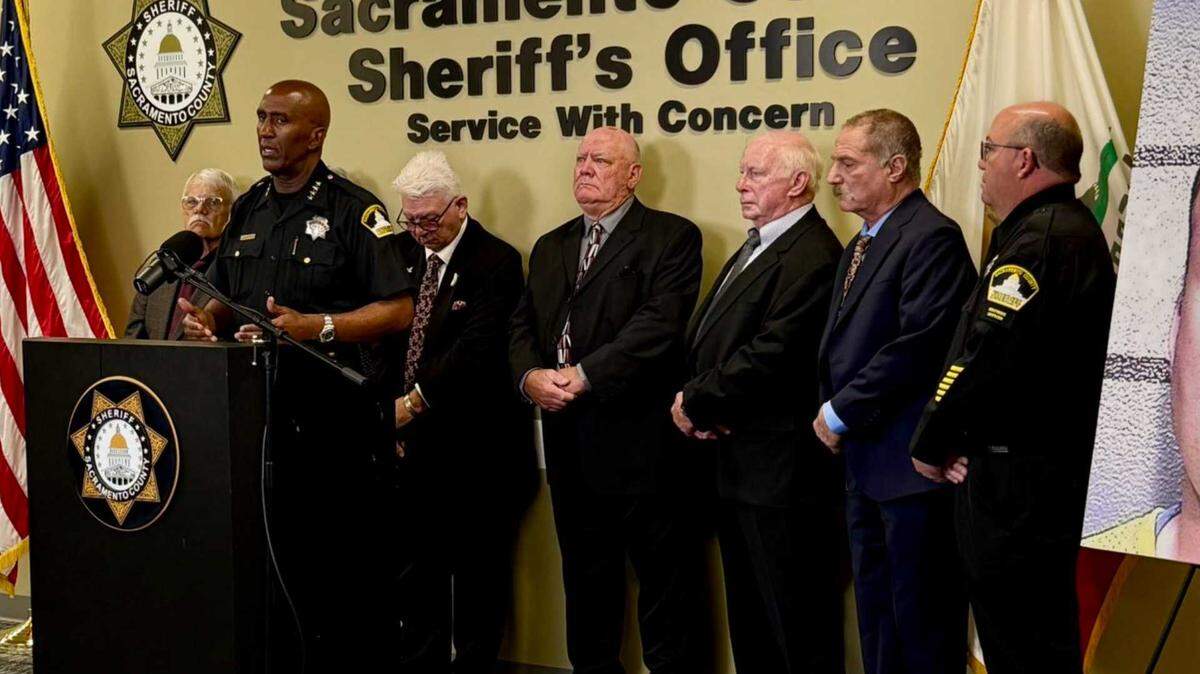 Sacramento County Sheriff Jim Cooper speaks at the podium alongside retired law enforcement officers at the Sheriff’s Office headquarters in Old Foothill Farms on Wednesday, March 25, 2026. Cooper announced a proposed 2028 ballot initiative to revise Proposition 57 to prohibit sexually violent predators from being eligible for early parole following recent controversy over the release of convicted sex offenders.