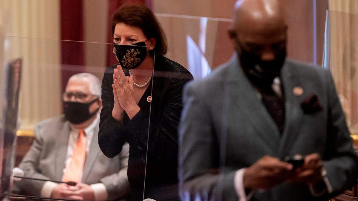 California Senate President Pro Tem Toni Atkins, D-San Diego, acknowledges a colleague during the opening of the Legislature’s 2021-2022 session at the state Capitol on Monday, Dec. 7, 2020 in Sacramento. Unlike the larger Assembly, which met in Golden 1 Center because of social distancing concerns, the 39 state Senators (one seat is vacant) met in the Senate chambers, but guests were strictly prohibited.