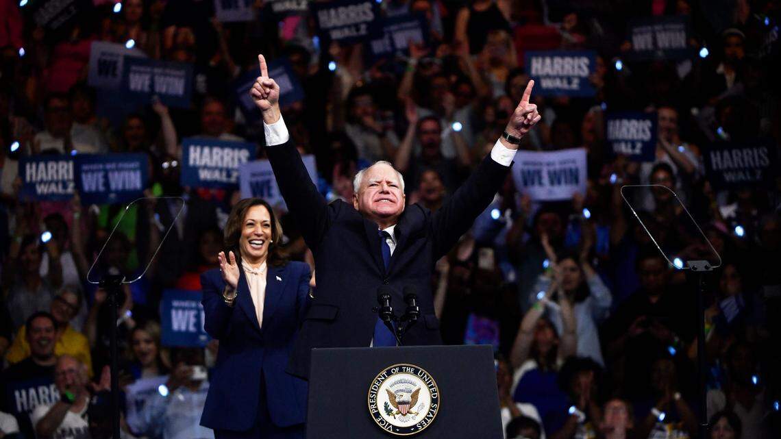 Vice President Kamala Harris, left, stands with her running mate Minnesota Gov. Tim Walz at a rally at Temple University in Philadelphia on Tuesday, Aug. 6, 2024.