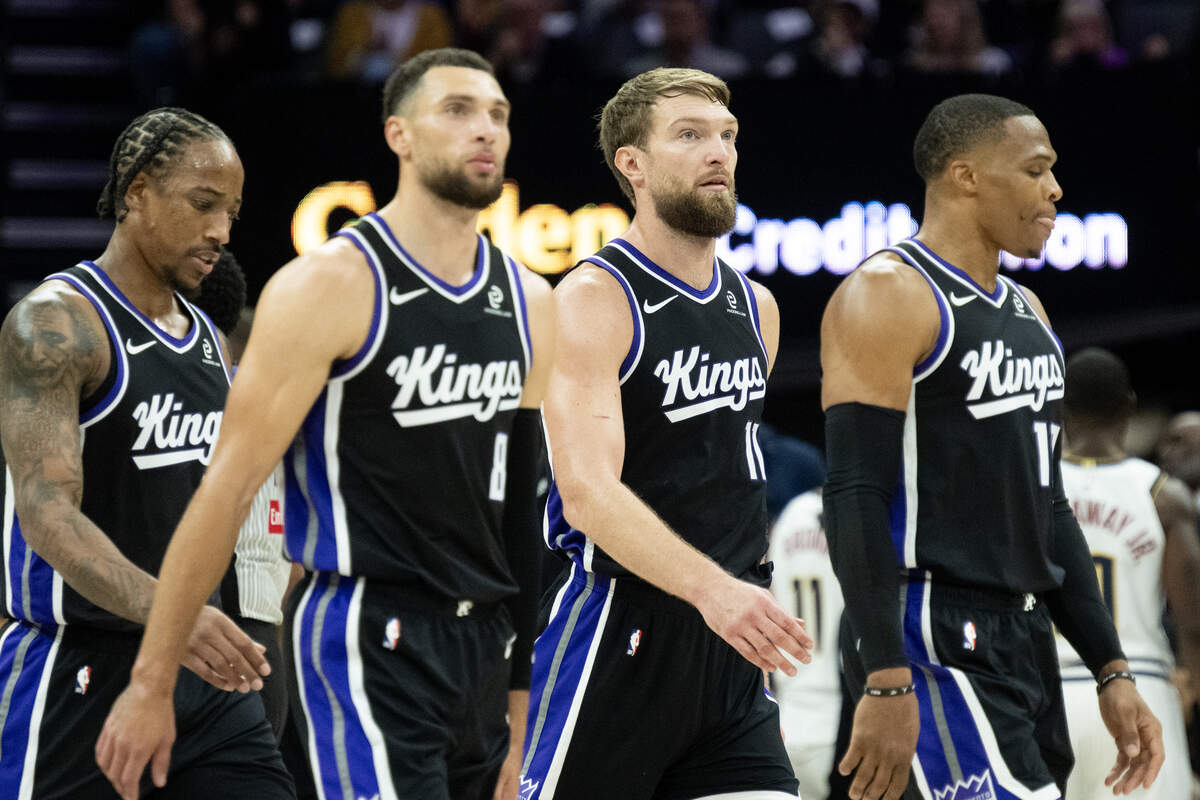 Sacramento Kings center Domantas Sabonis (11) with guard DeMar DeRozan (10), guard Zach LaVine (8) and guard Russell Westbrook (18) walk to the bench during a game against the Denver Nuggets at the Golden 1 Center on Tuesday, Nov. 11, 2025, in Sacramento.