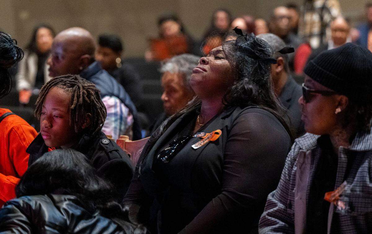 Keith “KJ” Frierson’s mother, Brittani Frierson, center, sits with her family during his funeral service at Liberty Towers Church in Foothill Farms on Saturday. Frierson, 10, was killed by another ten-year-old boy who found a gun in his father’s vehicle and shot his friend.