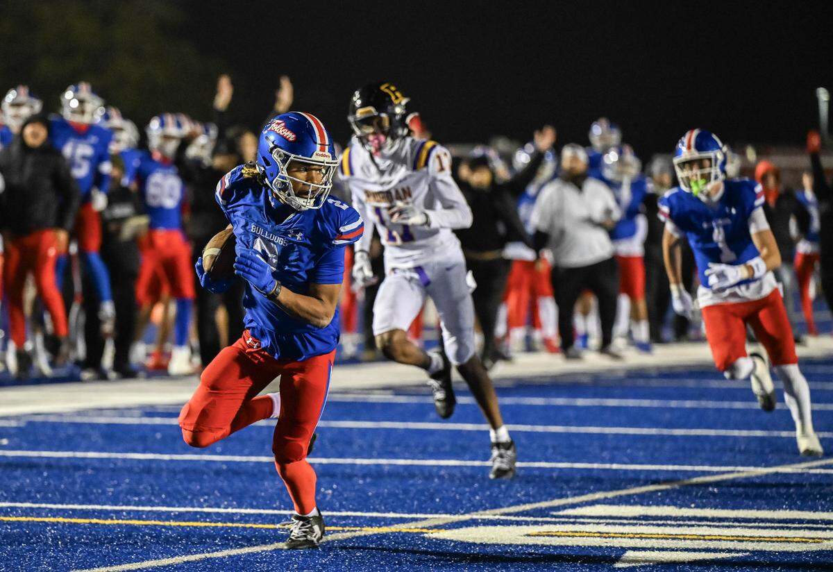 Folsom Bulldogs wide receiver Jameson Powell (2) finds the end zone for the game-winning touchdown after 20-yard reception from quarterback Brody Rudnicki against the Riordan Crusaders In a CIF Northern California Regional Division 1-AA football championship game in Folsom on Friday.