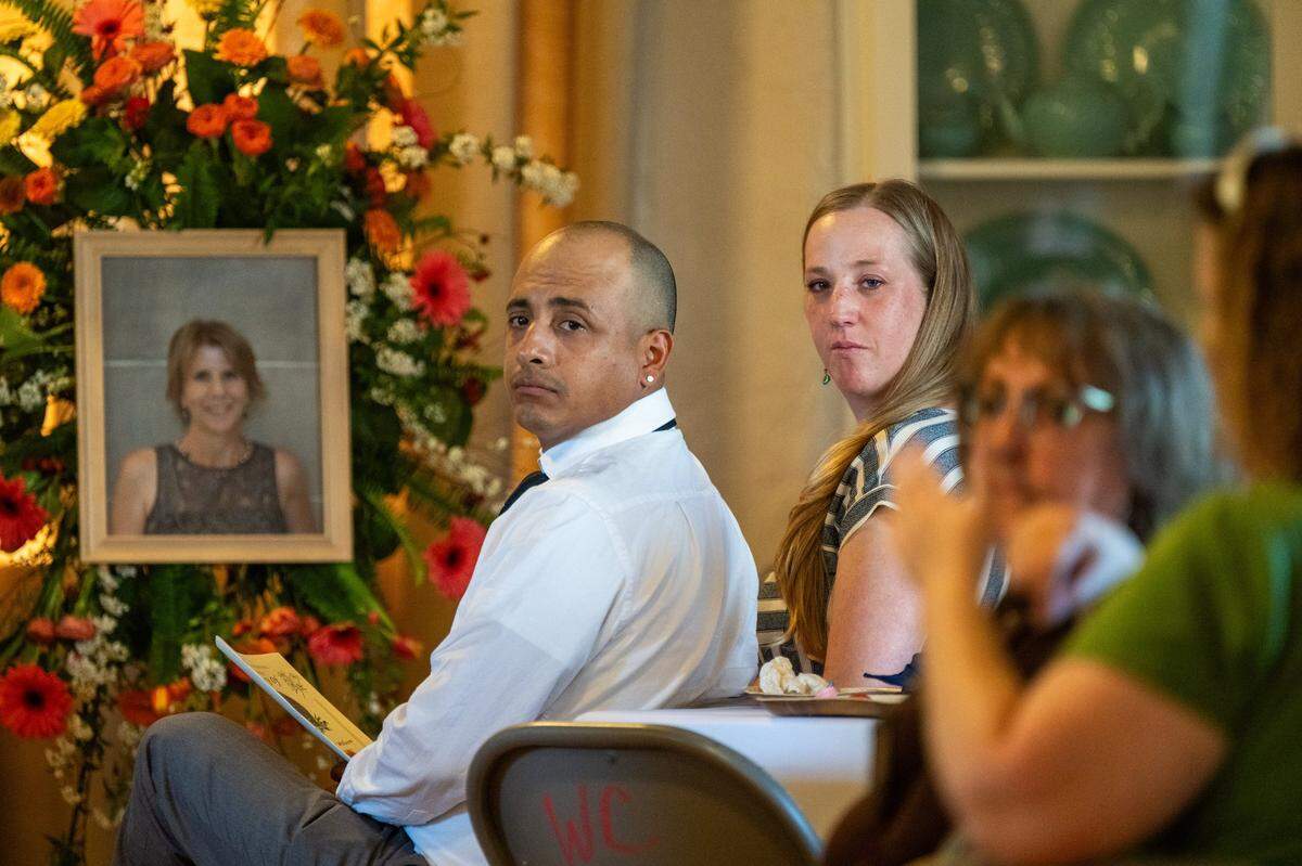 Azelyn Failor and her husband Cruz Marquez look back as a family friend shares memories at a memorial service for Failor’s mother Machelle Wilson at the Woman’s Club of Lincoln earlier this month. Wilson was a UC Davis biostatistician who was hit by a car while crossing a Sacramento County street in October and died last month.