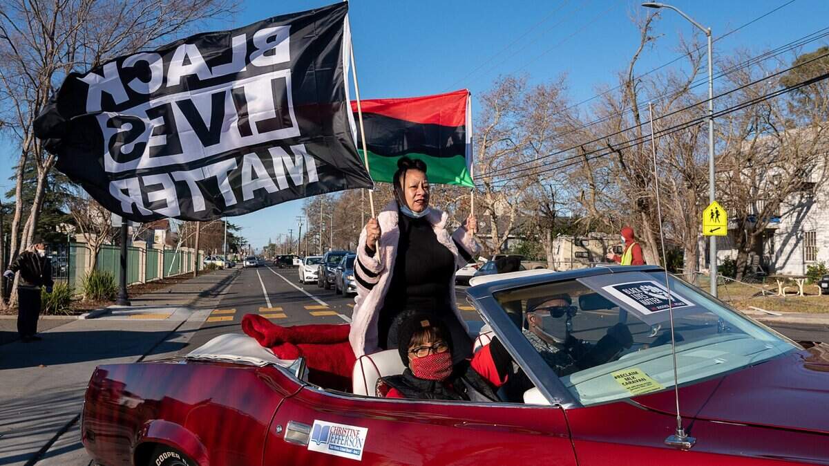 Black Lives Matter Sacramento founder Tanya Faison leads the #ReclaimMLK Day car caravan organized by BLM Sacramento and the NCAAP in celebration of Martin Luther King Jr. Day as they start from Grant High School on Monday, Jan. 18, 2021 in Sacramento.