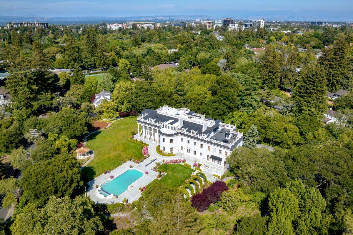 The Western White House is surrounded by a forest of trees in a private setting.