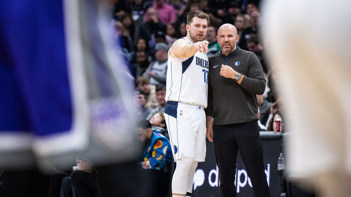 Dallas Mavericks guard Luka Doncic (77) talks with head coach Jason Kidd during the fourth quarter against the Sacramento Kings at the NBA basketball game Saturday, Feb. 11, 2023, at Golden 1 Center in Sacramento.