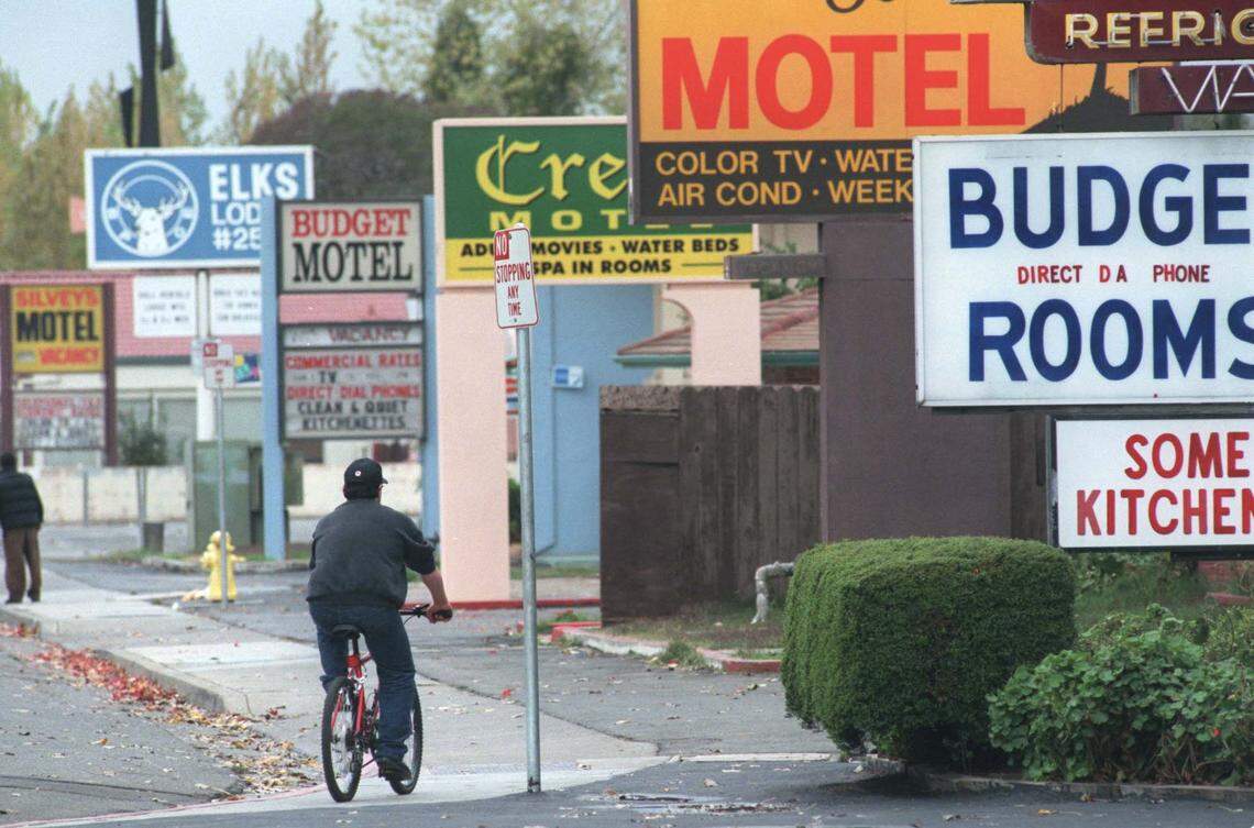 Signs for budget motels line West Capitol Avenue in West Sacramento in 1997. Ten years after the city’s incorporation, it was still known for adult-oriented businesses and an industrial waterfront.